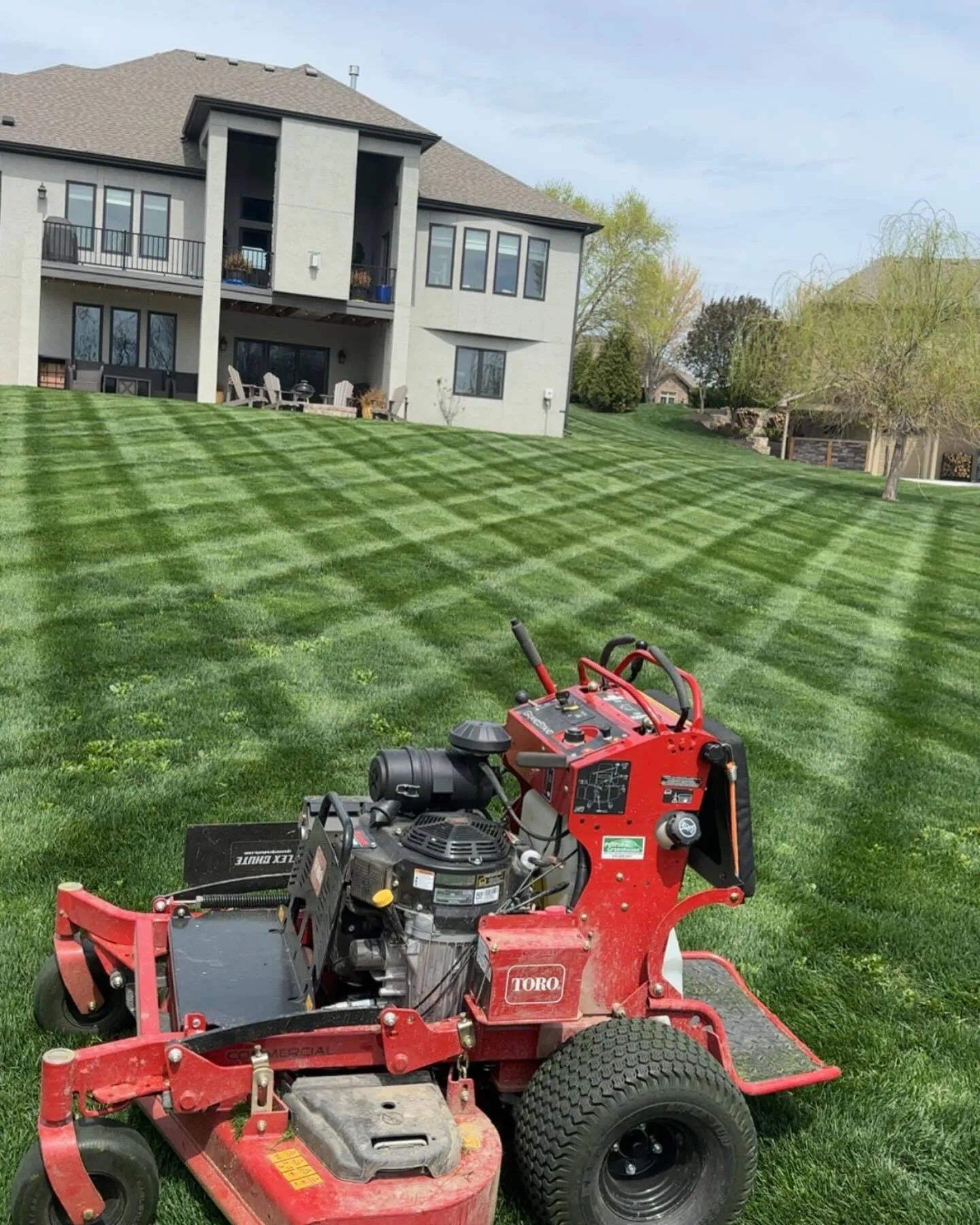 Urban Diamond mowing equipment creating crosshatch pattern in KC Northland