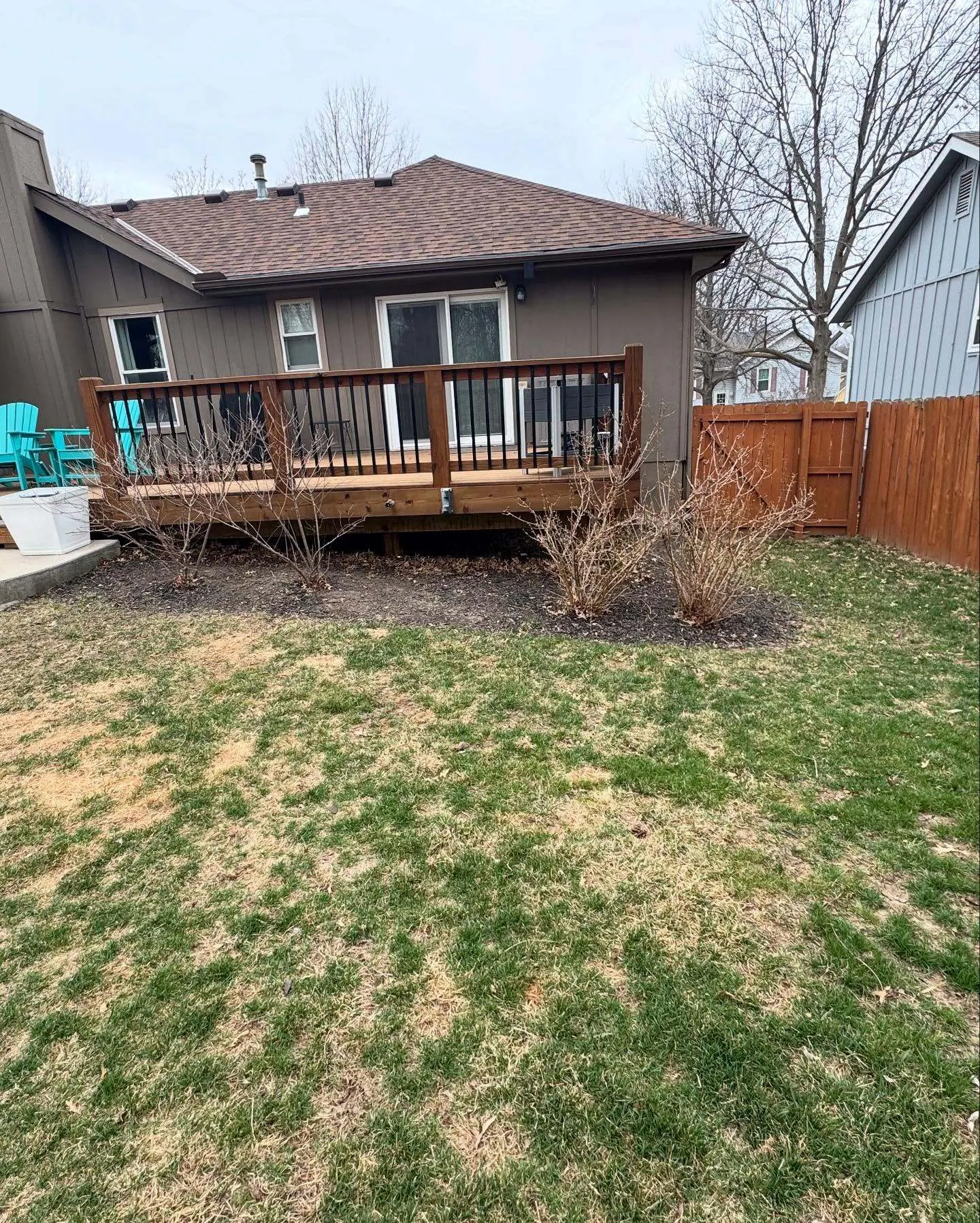 Wooden deck area with surrounding landscape maintenance