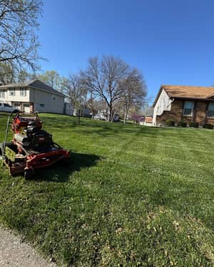 Professional lawn mower in action